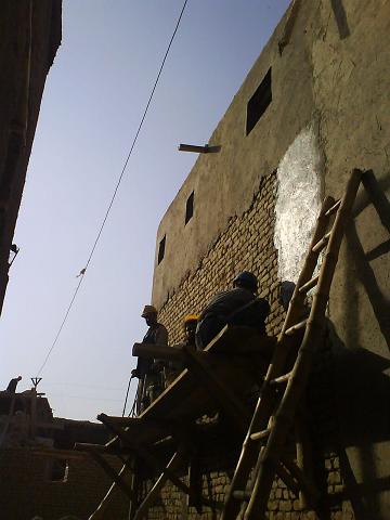 Rendering a mud-brick wall with cargil, literally mud-straw. Note the small street-side windows for privacy.